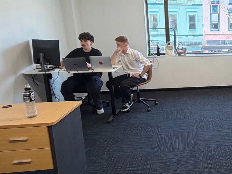 Cole and Robbie working together at the MyAgency head office in Dunedin