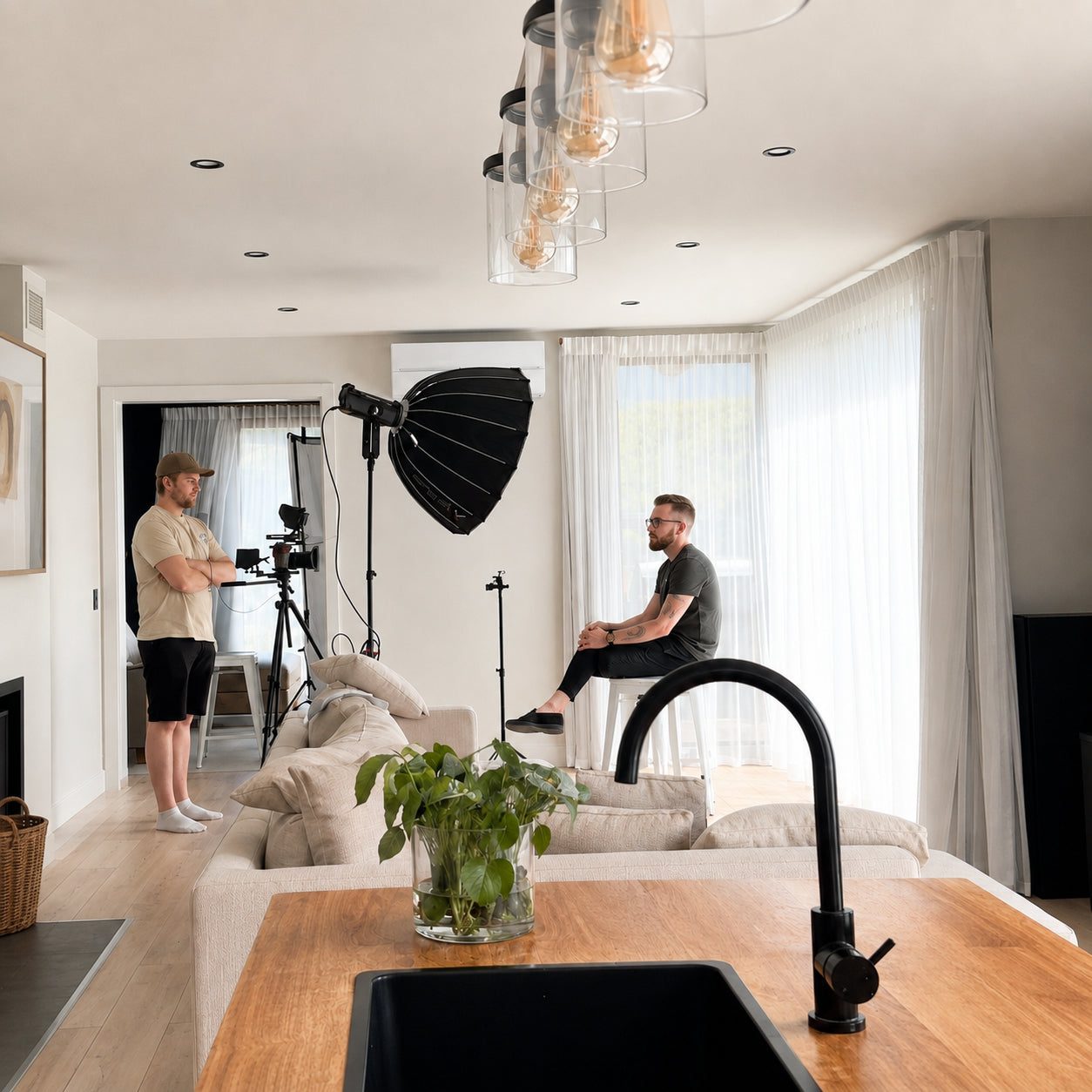 Two people filming an interview in a client’s living room